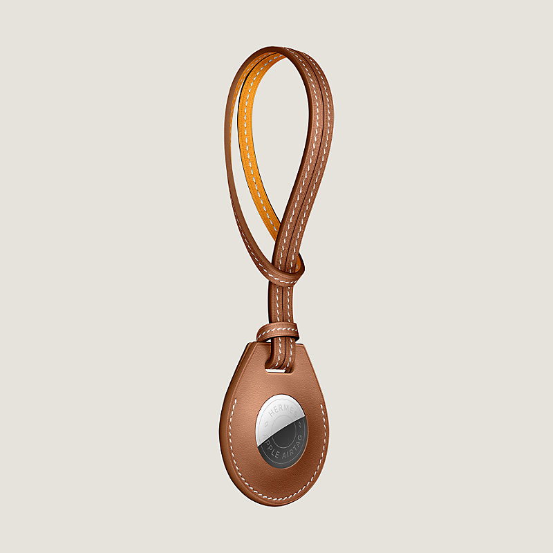 Apple AirTag Hermès bicolor bag charm | Hermès Canada